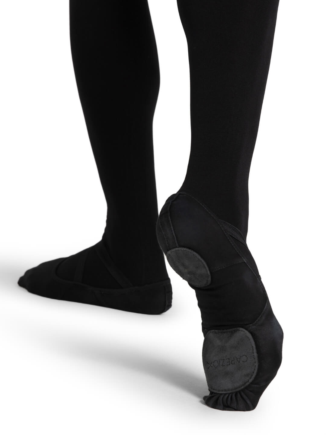 Black ballet shoes with soles on a white background
