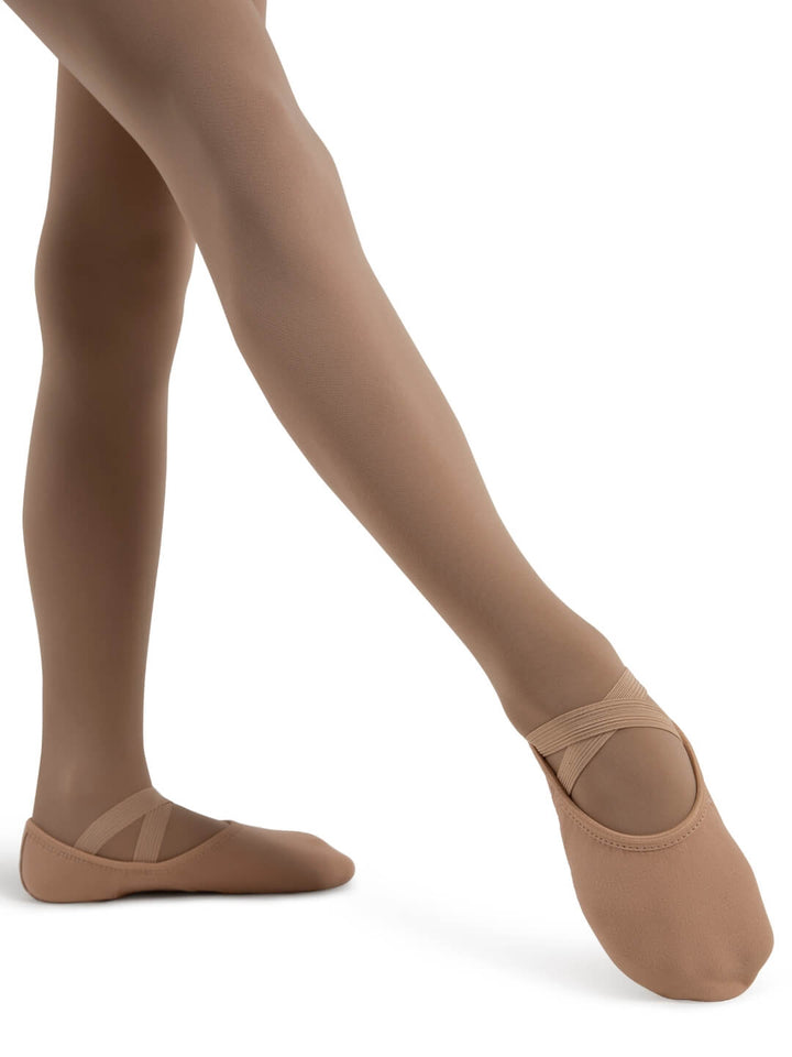 Ballet shoes and tights on a white background