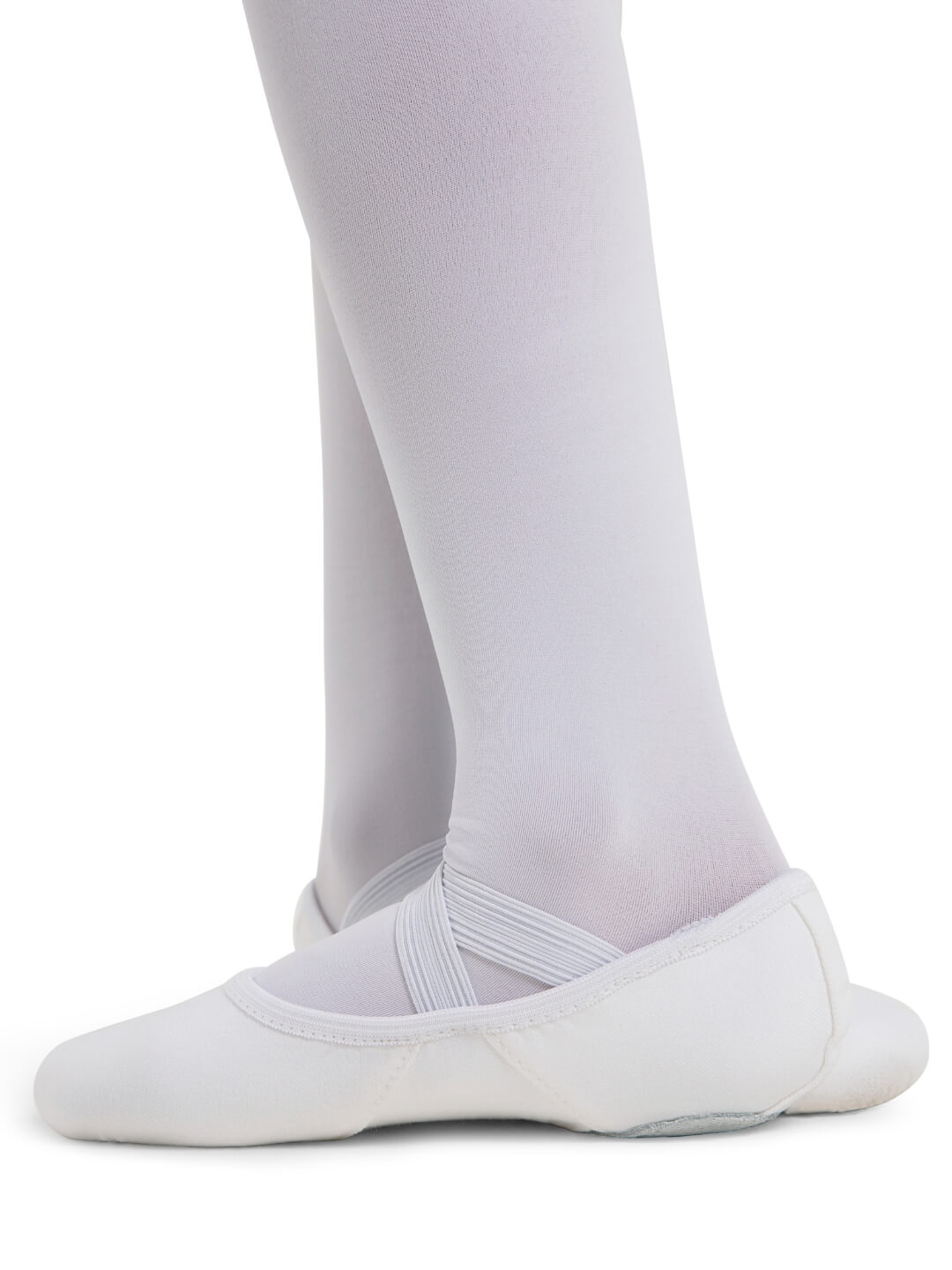 White ballet shoes worn with white tights on a white background