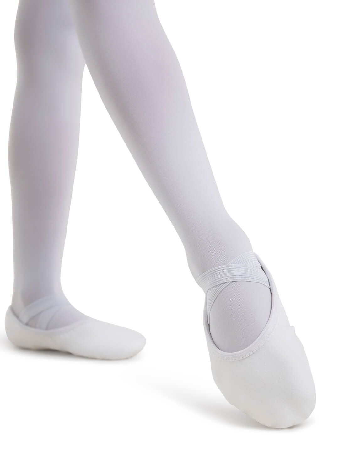 White ballet shoes worn with white tights on a white background