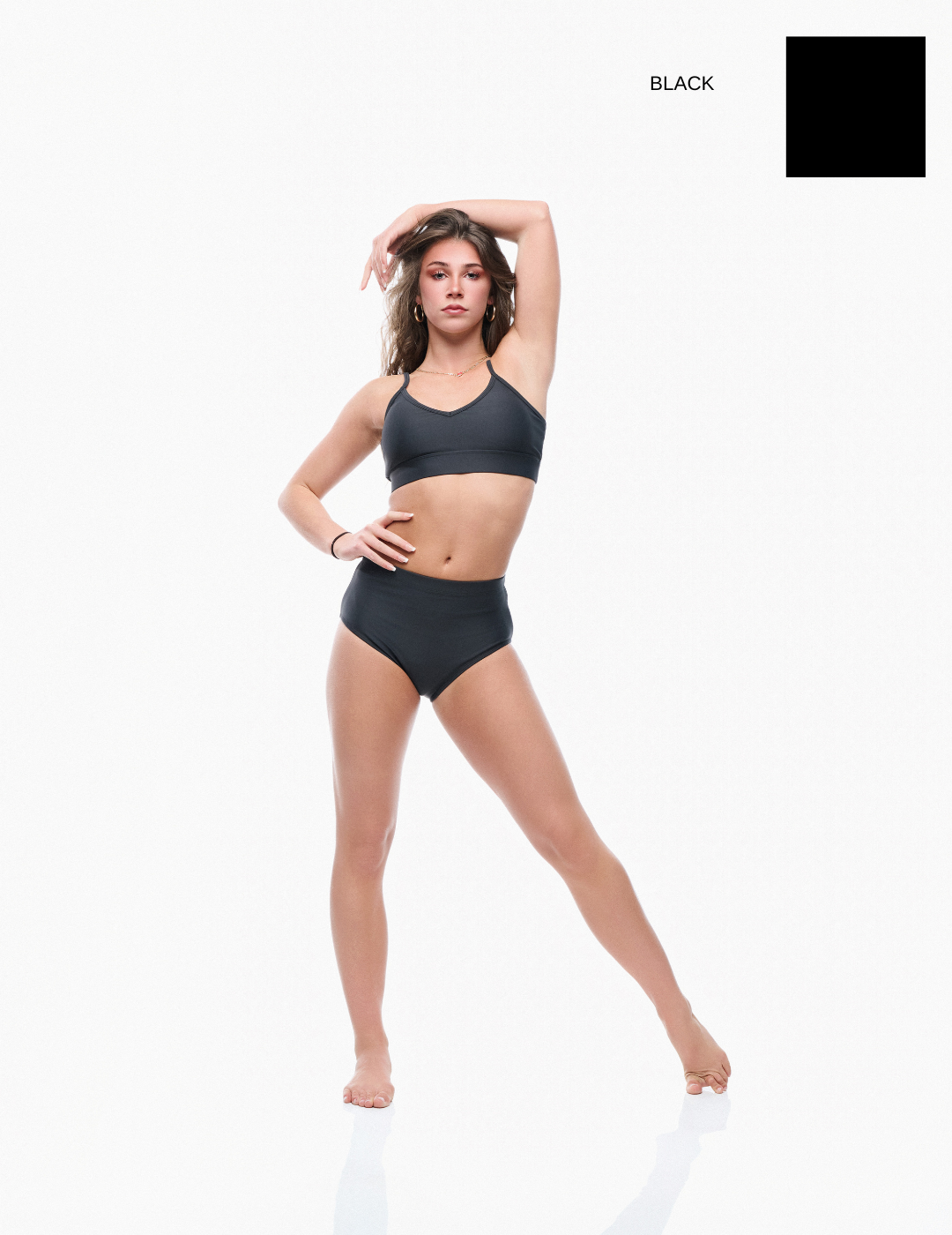 Woman wearing a black bikini on a white background with 'Wax Yellow' text.