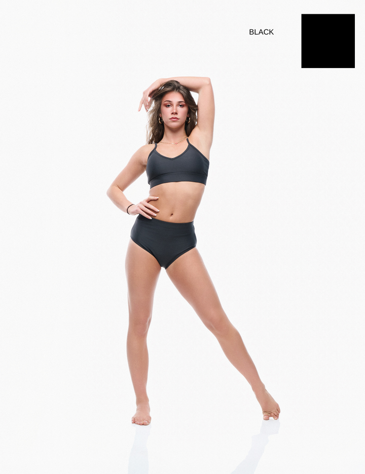 Woman wearing a black bikini on a white background with 'Wax Yellow' text.