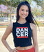 Woman wearing a black tank top with 'DANCER' printed on it, standing outdoors.
