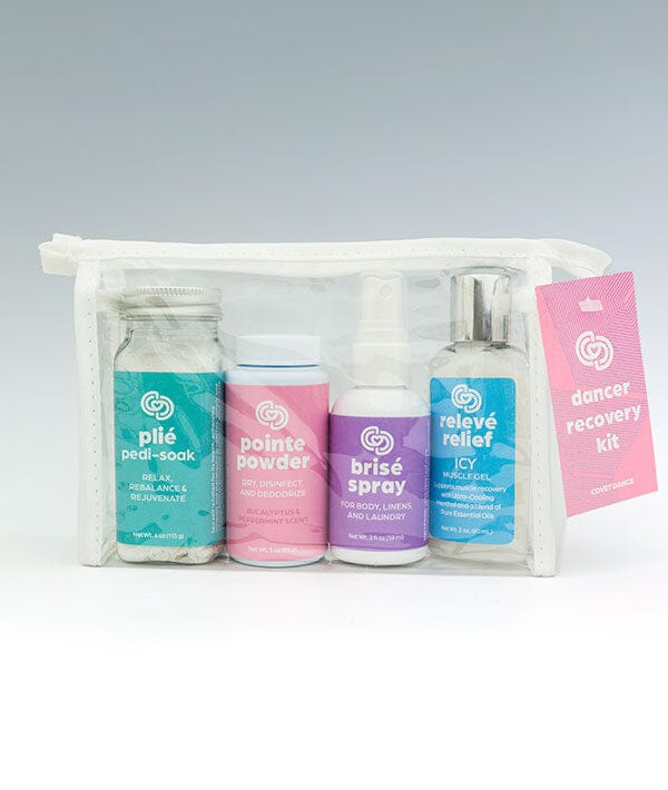 Dancer recovery kit with various bottles and a pouch on a white background