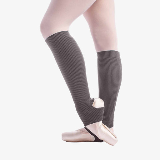 Person wearing gray knee-high socks with a white background