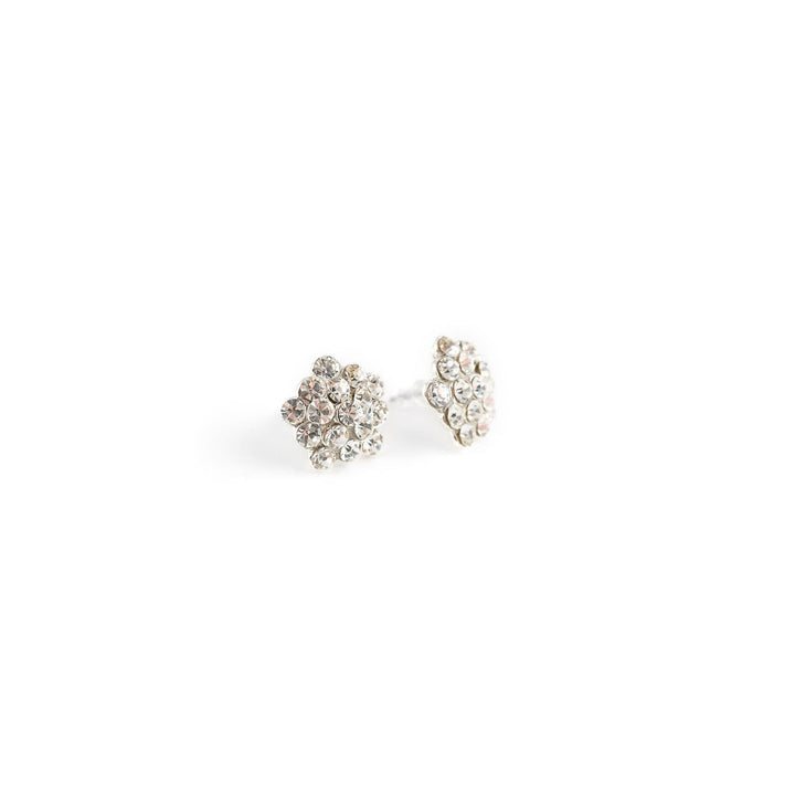 Pair of silver stud earrings with clear stones on a white background
