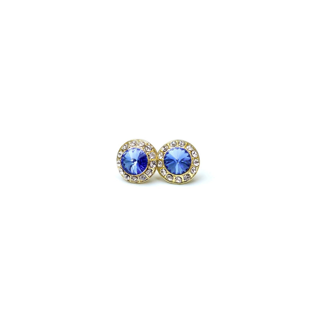 Pair of gold earrings with blue gemstones on a white background