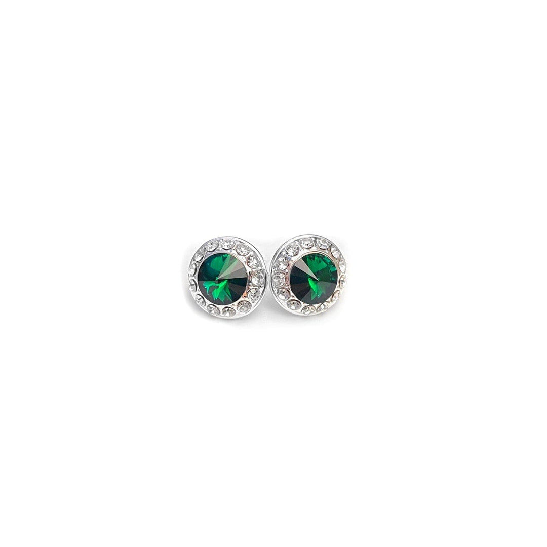 Silver earrings with green gemstones on a white background