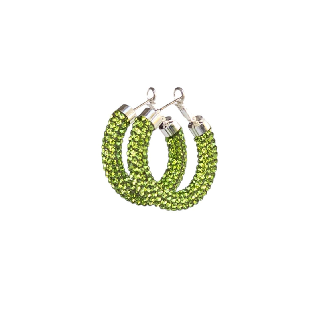 Green hoop earrings on a white background