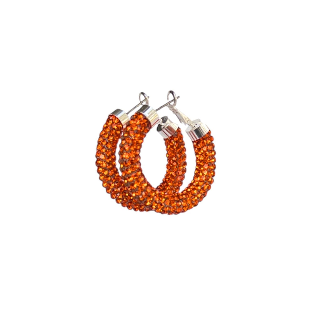 Orange beaded hoop earrings on a white background