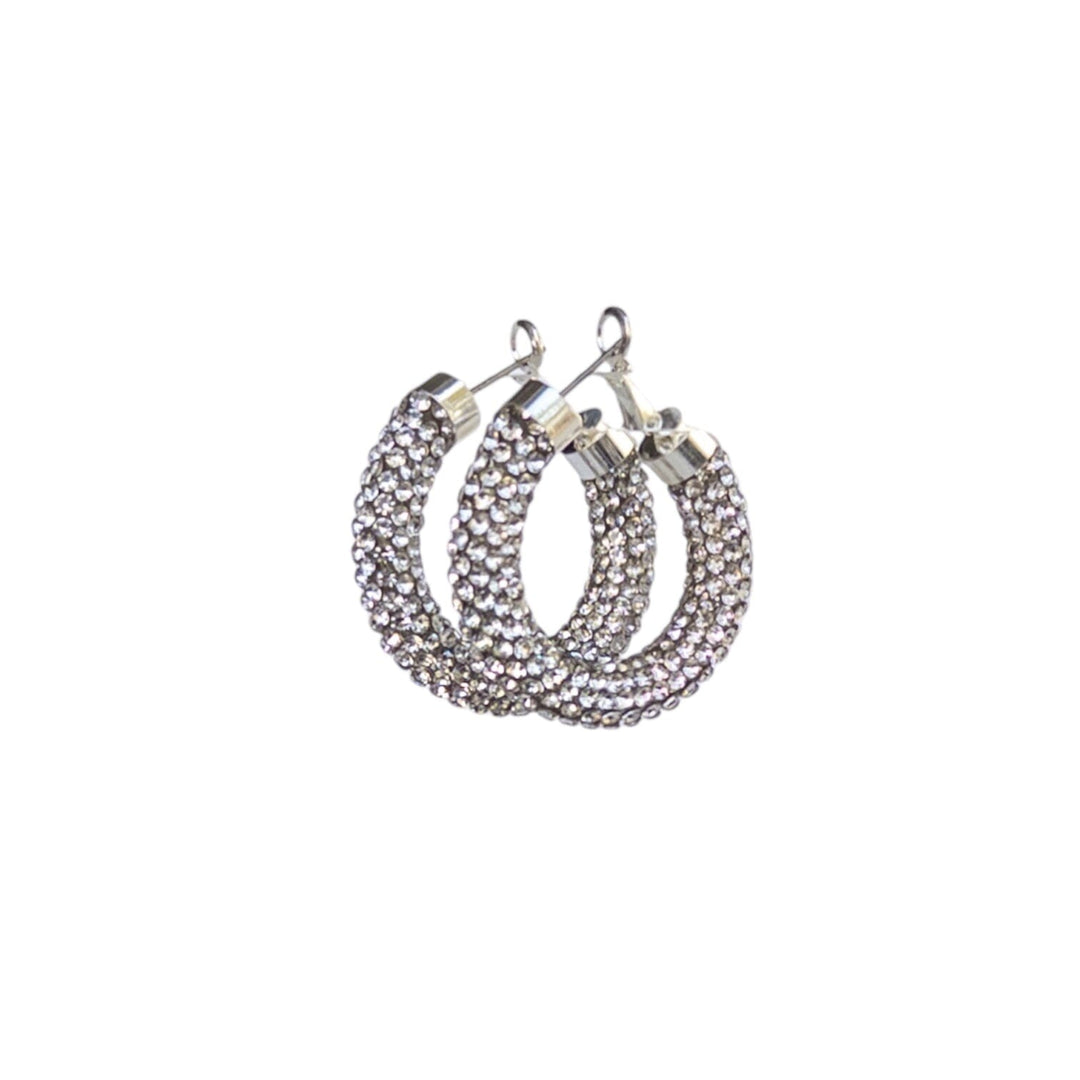 Silver hoop earrings with gemstones on a white background