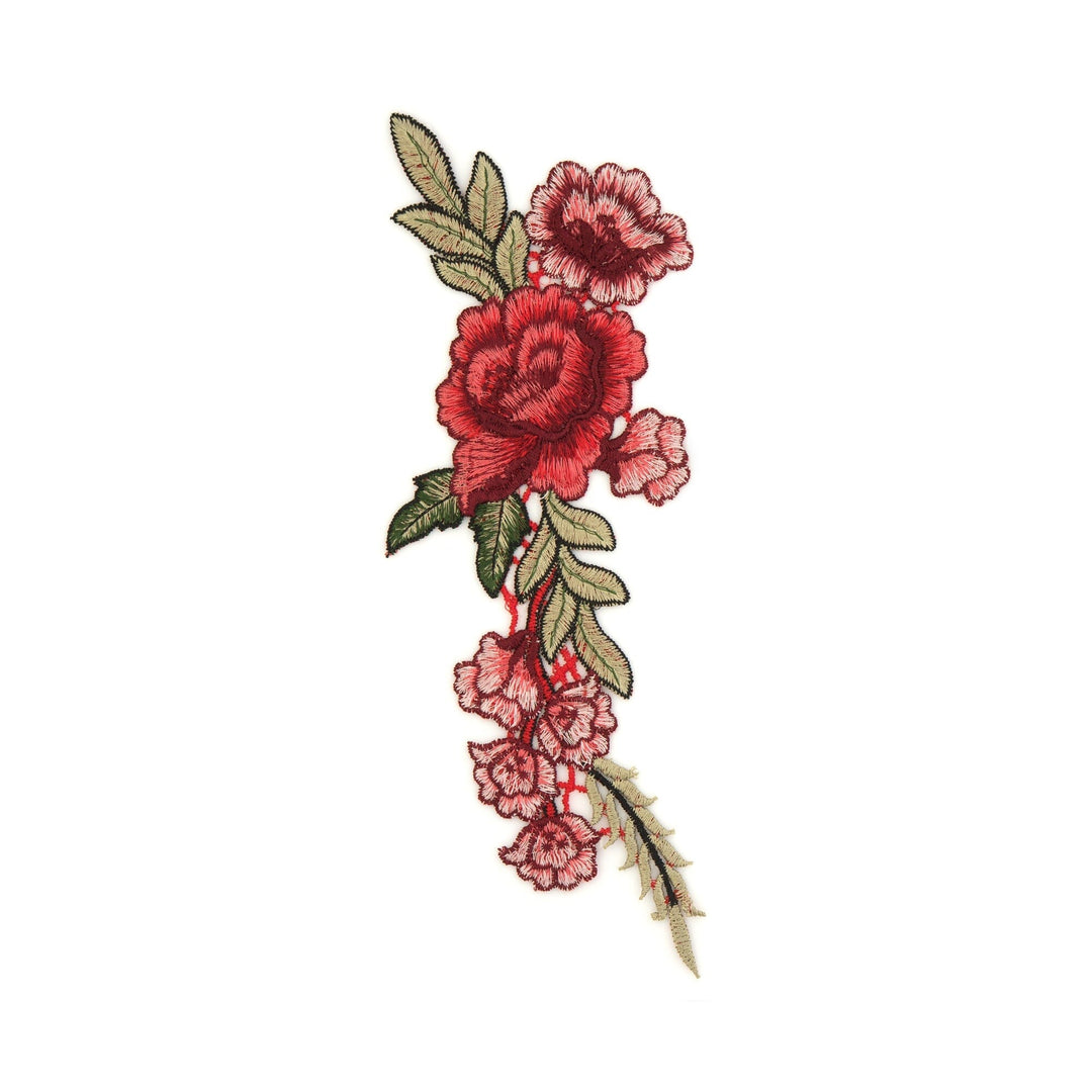 Embroidered floral design with red roses and green leaves on a white background