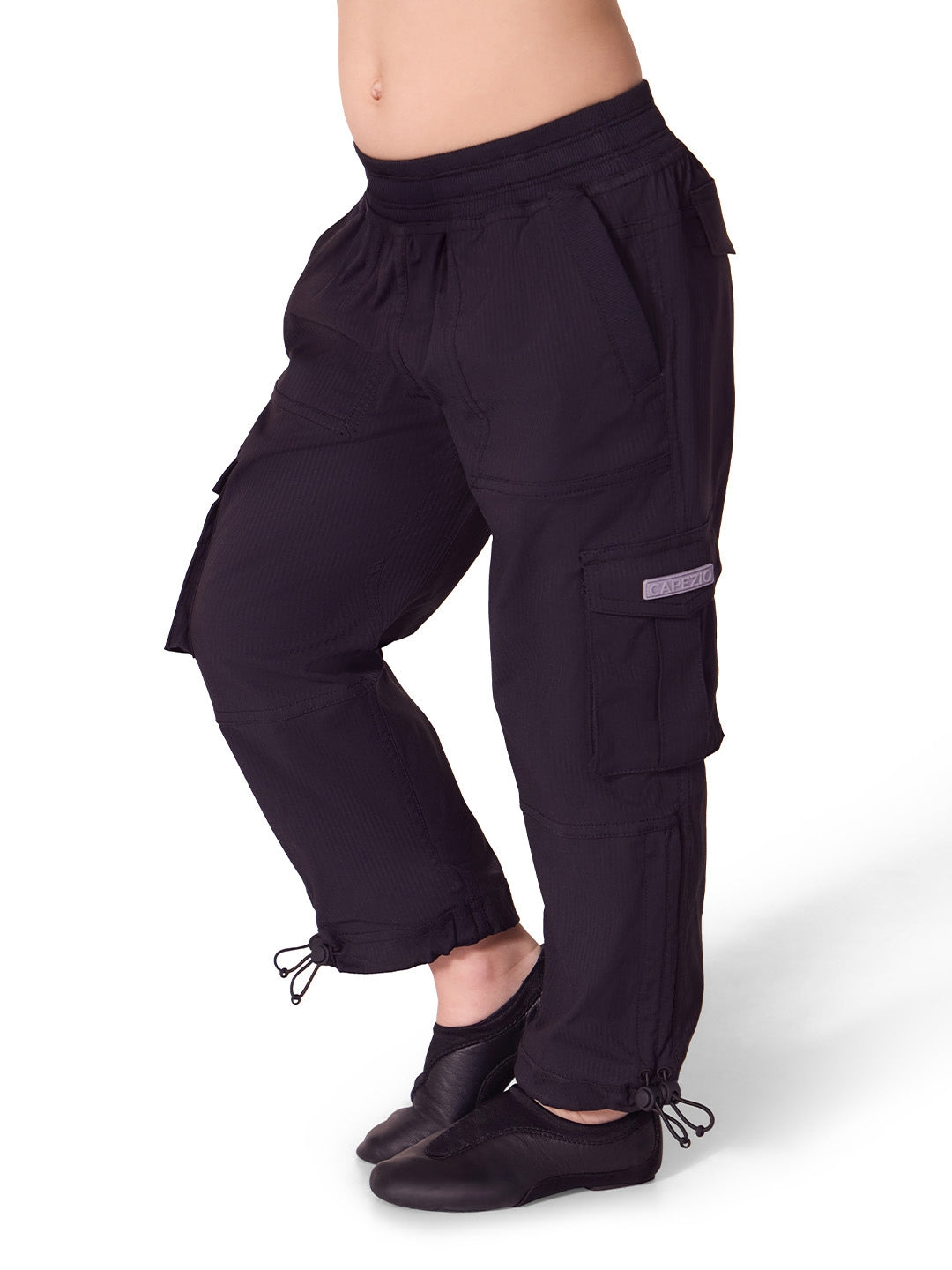 Black cargo pants worn by a person on a white background