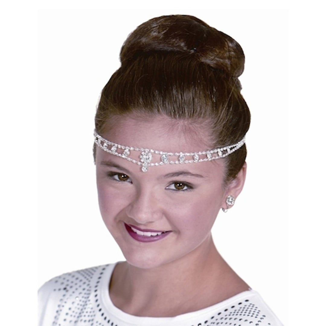 Woman wearing a sparkling headband on a white background