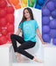 Dancer in a blue t-shirt with colorful balloons in the background