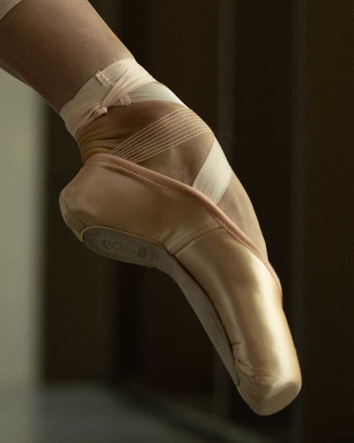 Ballet shoe with a dark background