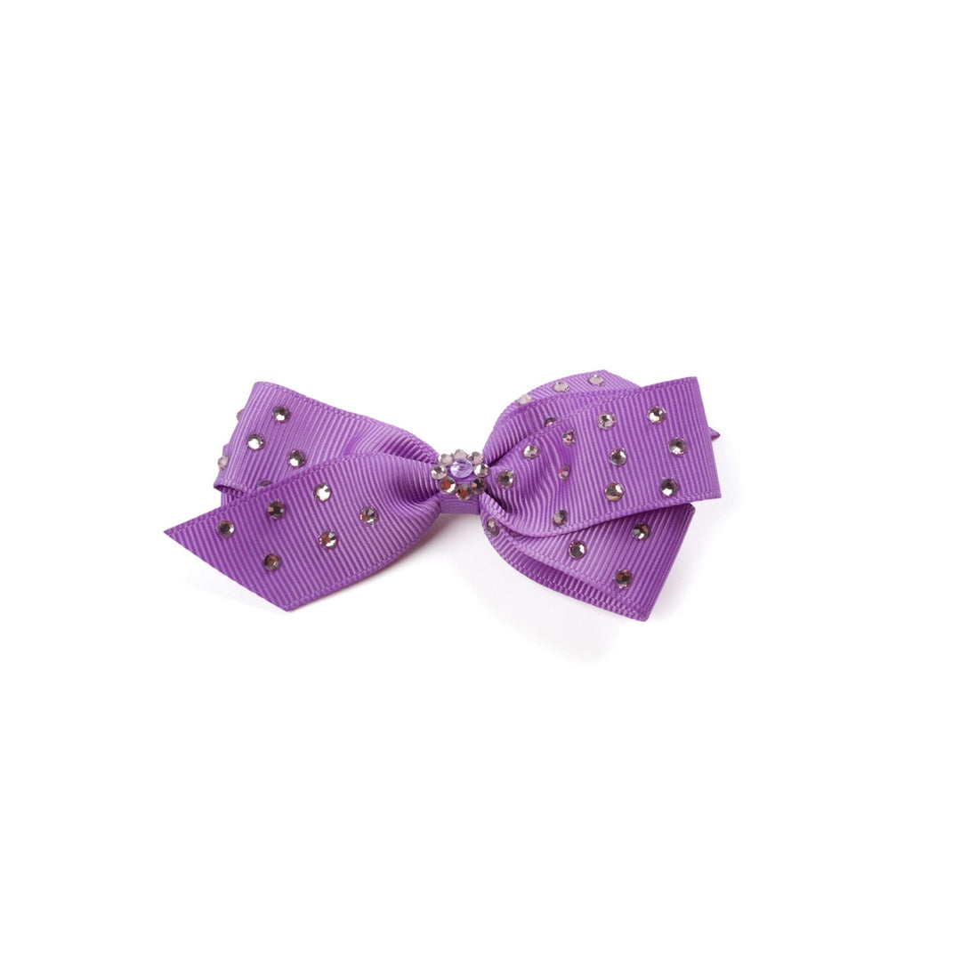 Purple bow with rhinestones on a white background