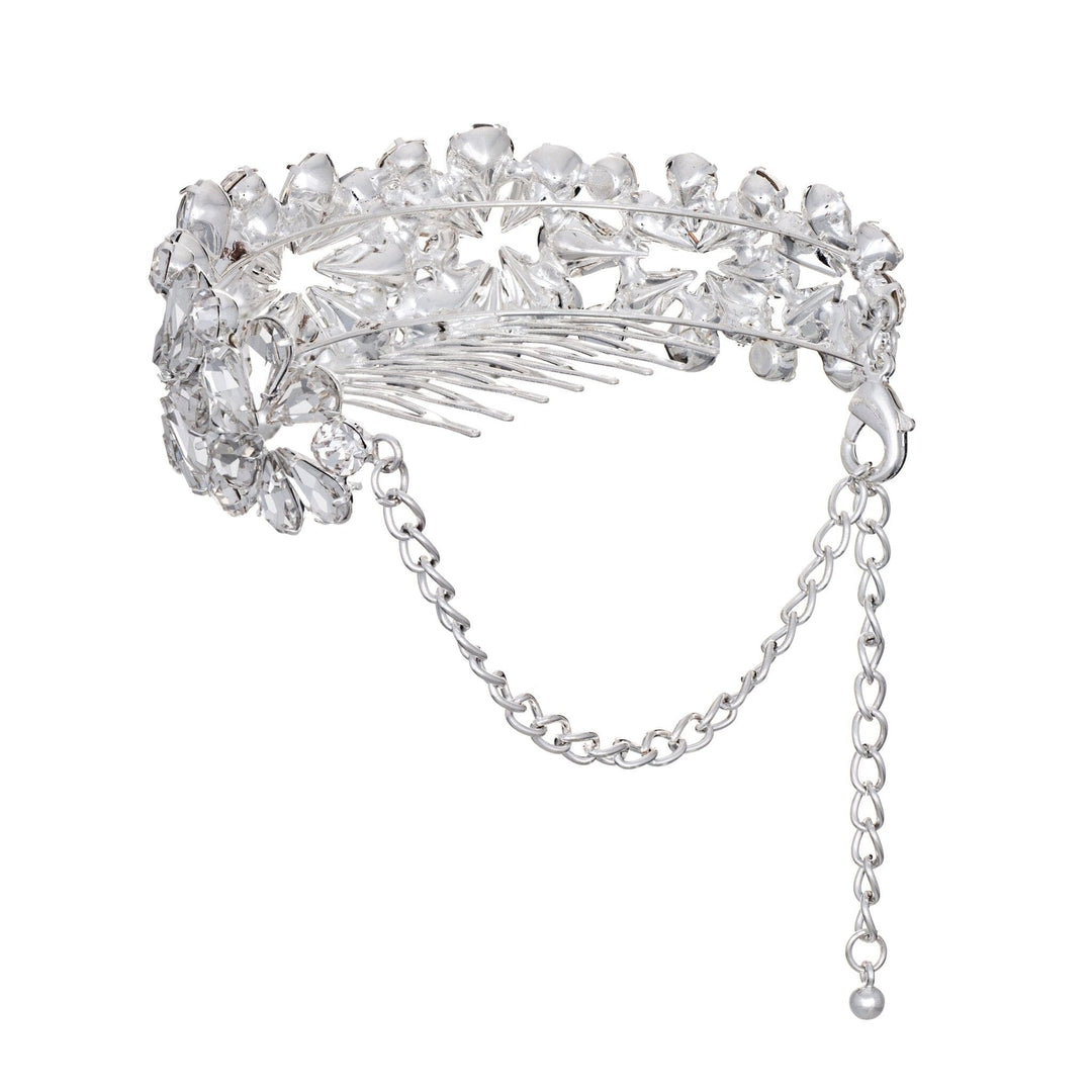 Silver hair comb with crystal-like stones on a white background