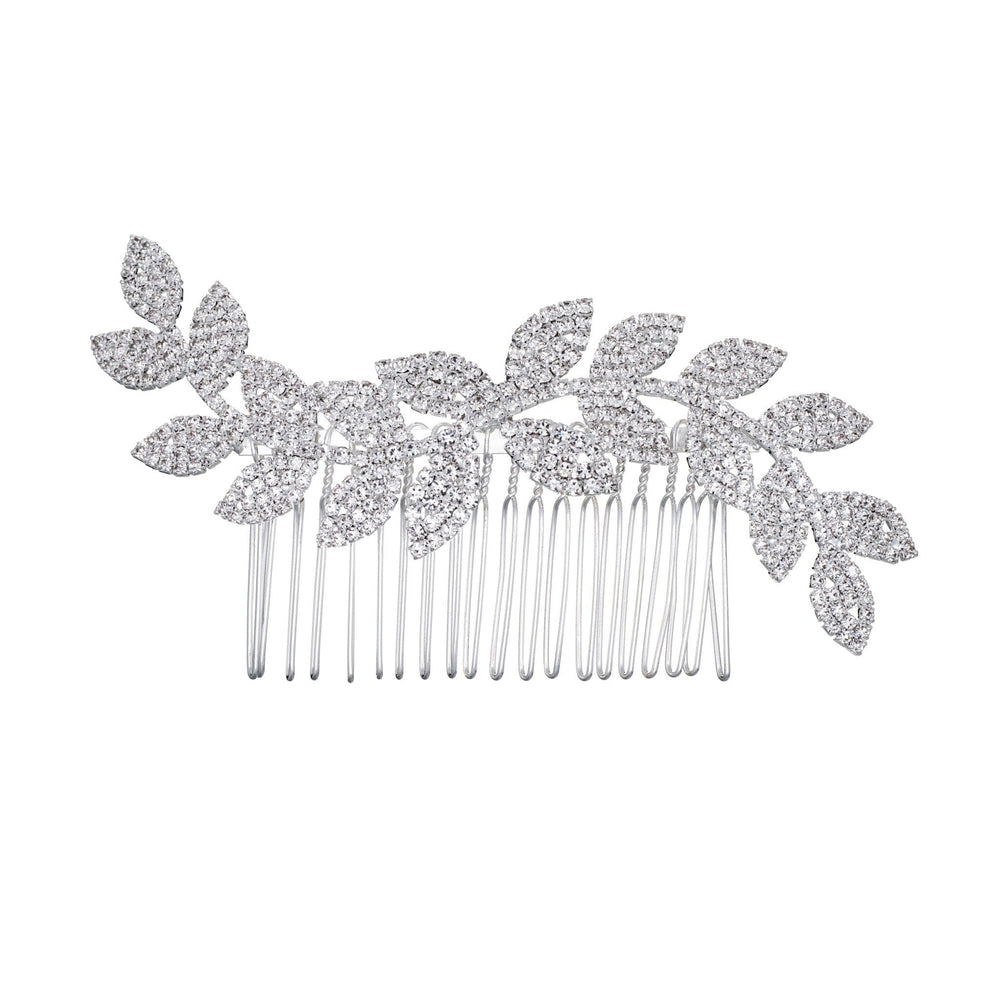 Silver hair comb with leaf-like designs on a white background