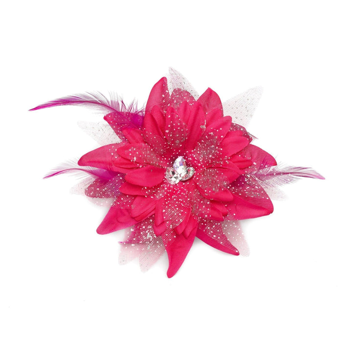 Pink flower accessory with feathers and a gemstone on a white background