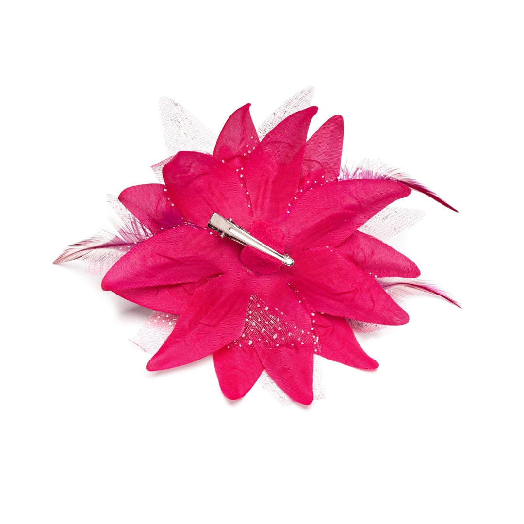 Pink feathered hair clip on a white background