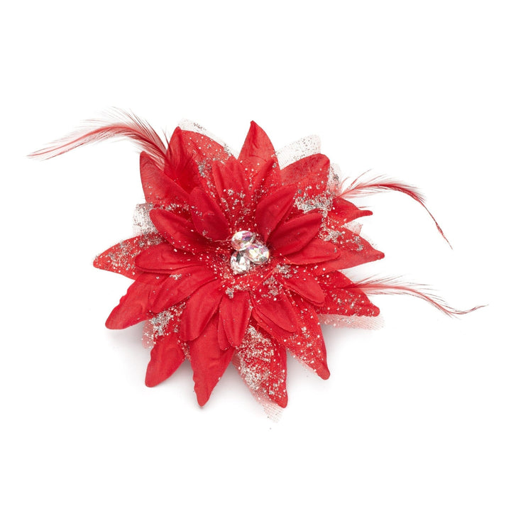 Red flower accessory with feathers on a white background