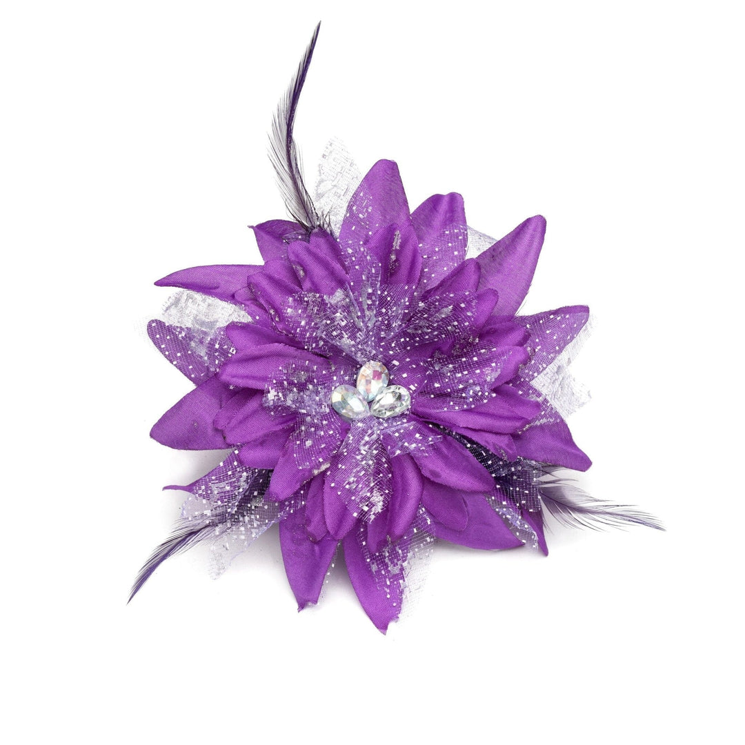 Purple flower accessory with feathers and a gemstone on a white background