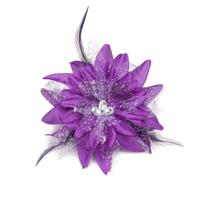 Purple flower accessory with feathers and a gemstone on a white background