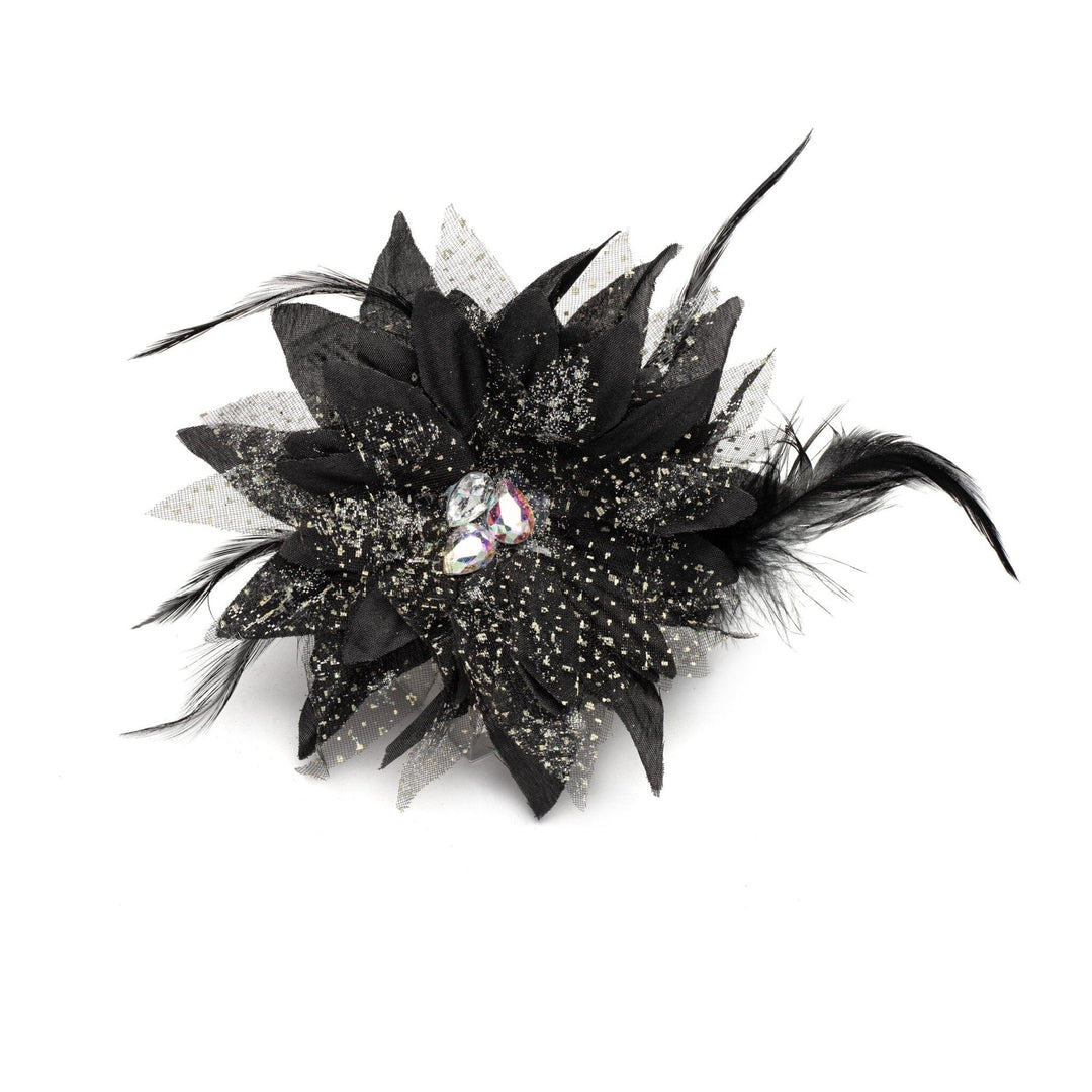 Black feathered flower accessory with a gemstone on a white background