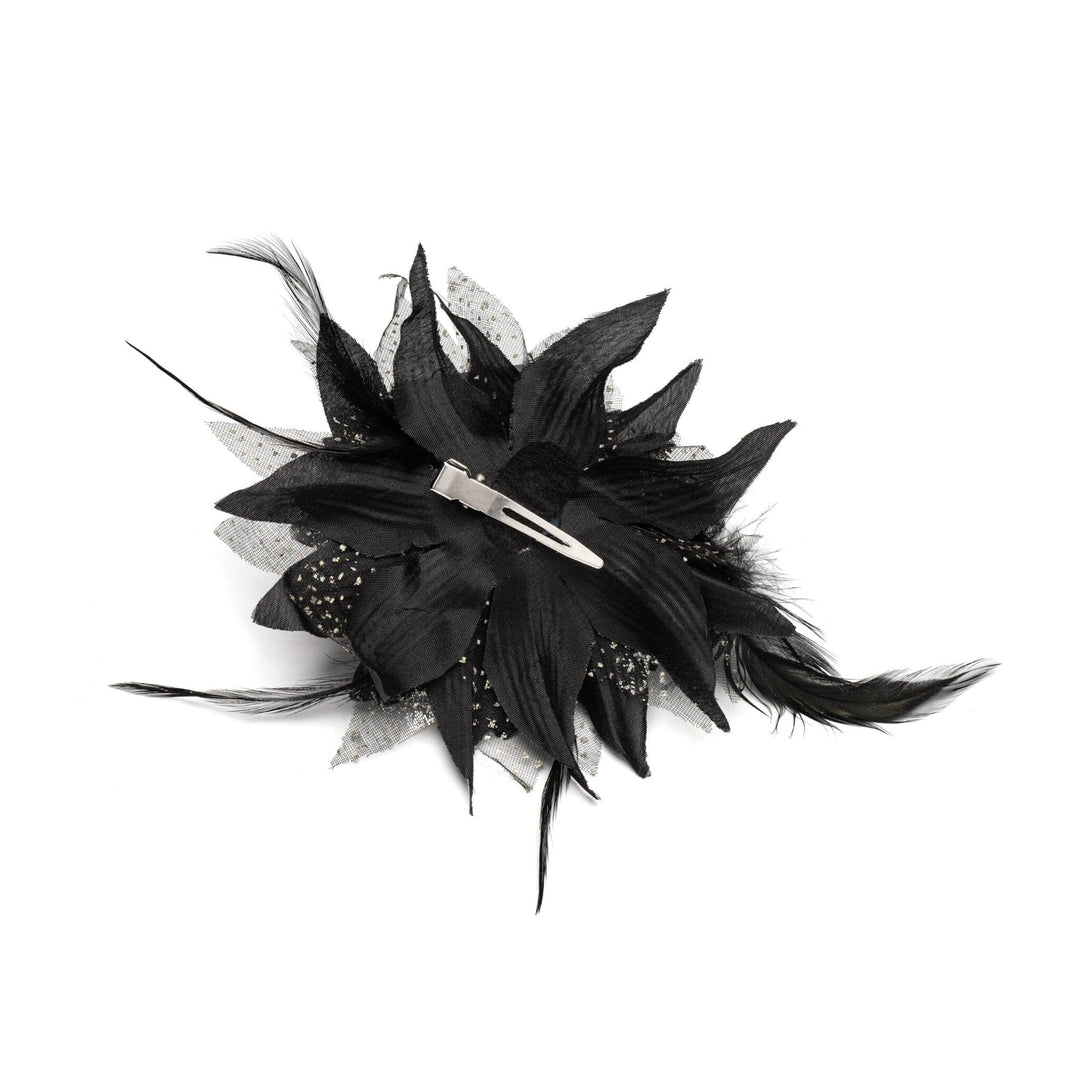 Black feathered hair accessory on a white background