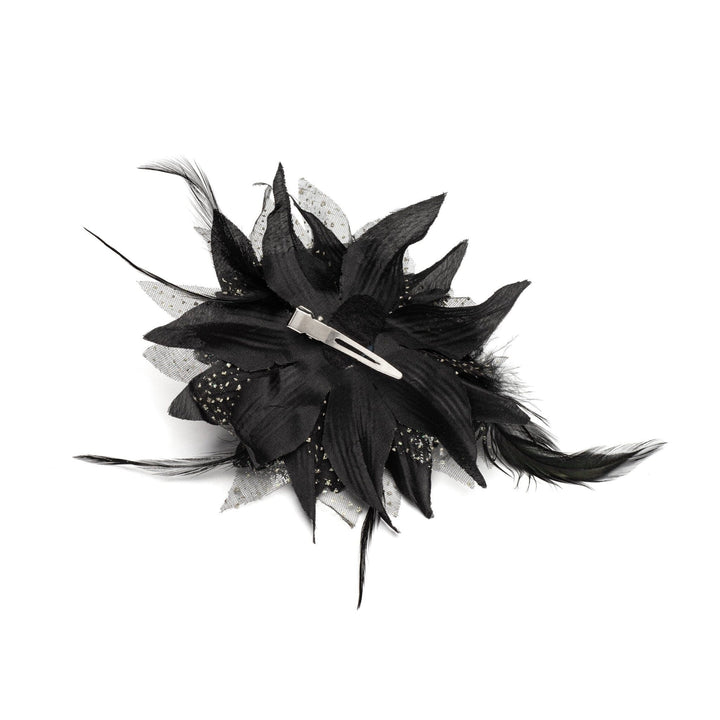 Black feathered hair accessory on a white background
