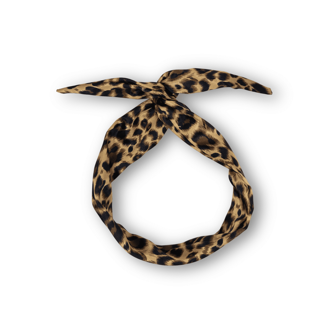 Leopard print headband on a white background