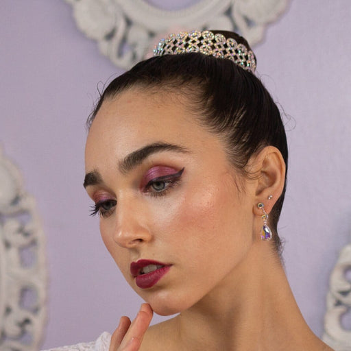 Woman wearing a tiara with a decorative background