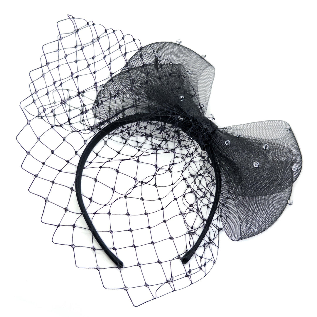 Black headband with netting and decorative bow on a white background
