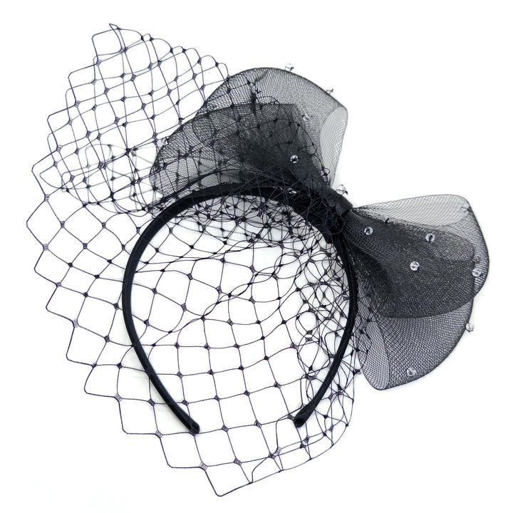 Black headband with netting and decorative bow on a white background