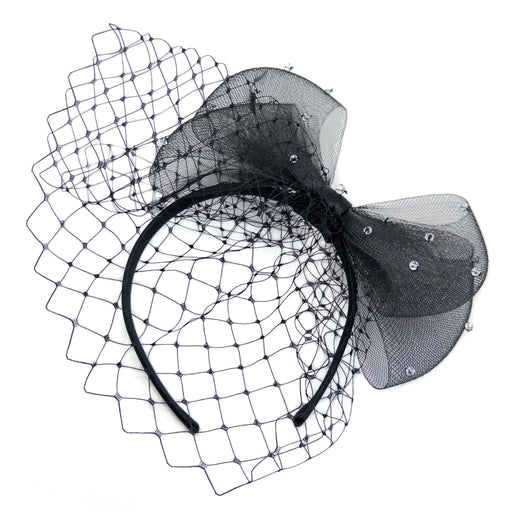 Black headband with netting and decorative bow on a white background