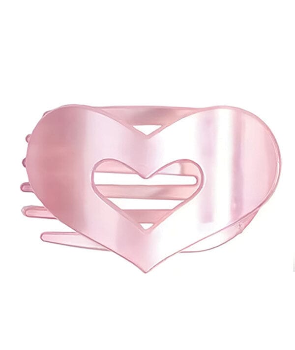 Pink heart-shaped hair clip on a white background