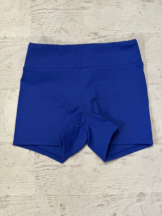 Blue shorts on a textured beige surface