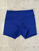 Blue shorts on a textured beige surface