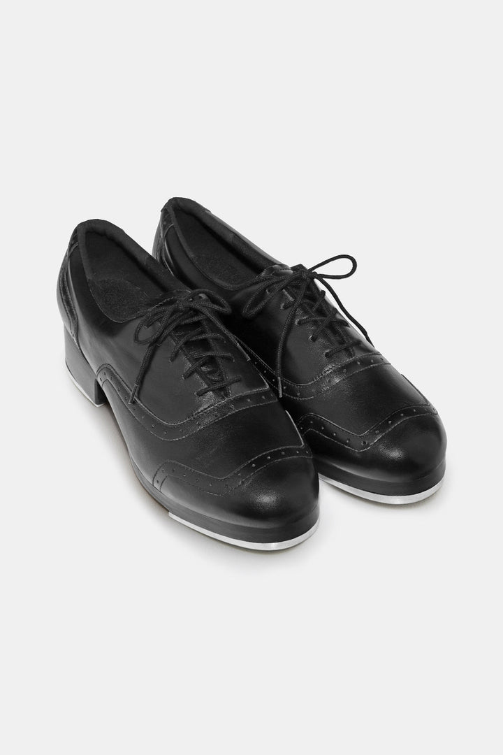 Pair of black leather shoes on a white background