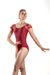 Woman wearing a red leotard with lace cap sleeves on a white background