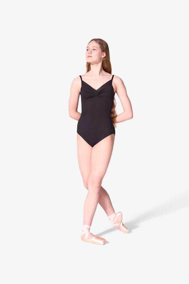 Young woman wearing a black leotard on a white background