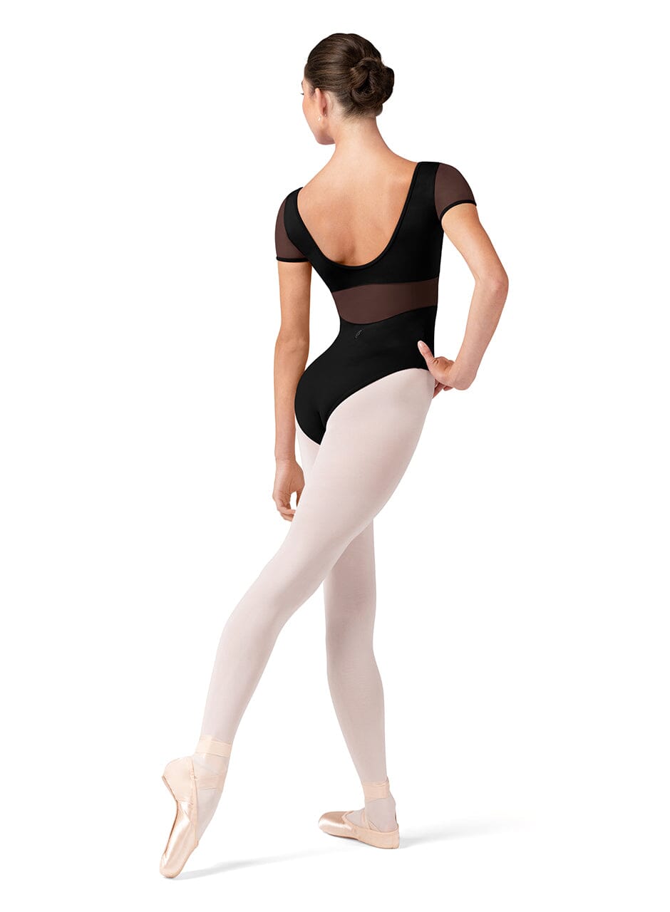 Ballerina in a black leotard and white tights on a white background