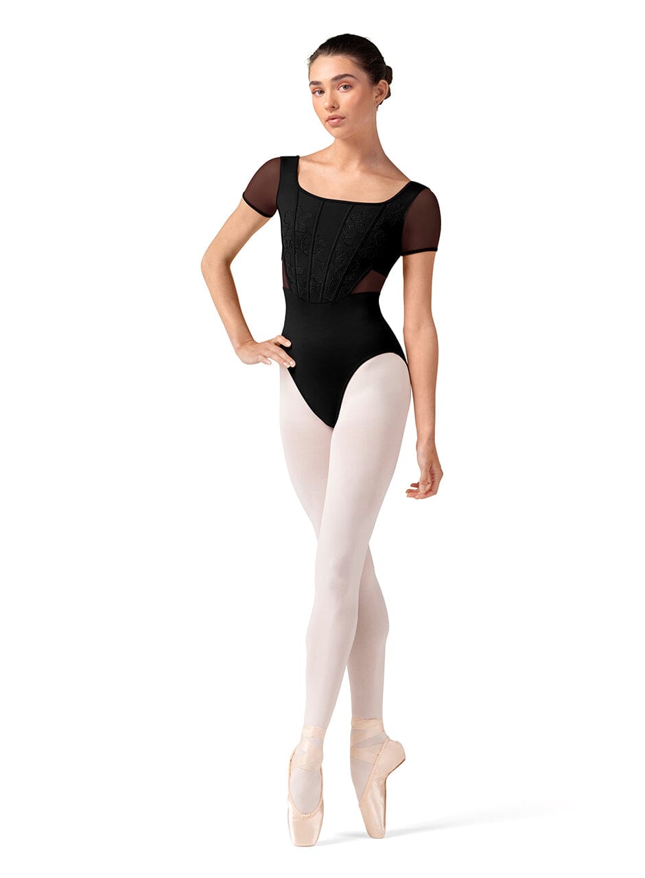 Dancer in a black leotard and white tights on a white background