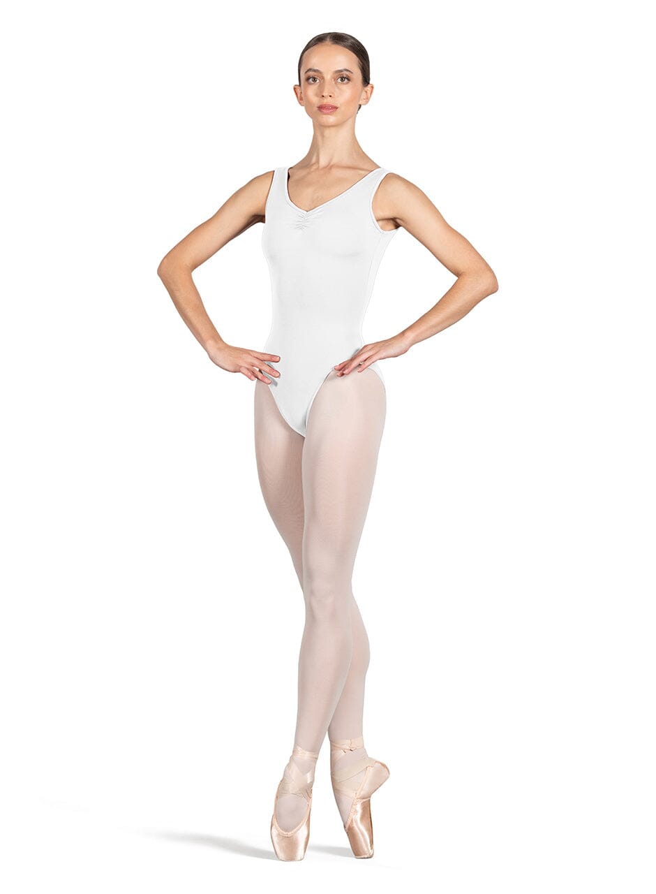Ballerina wearing a white leotard and beige tights on a white background