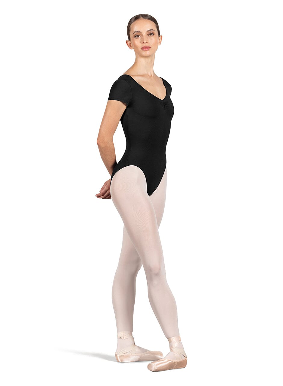 Ballerina in a black leotard and pink tights on a white background