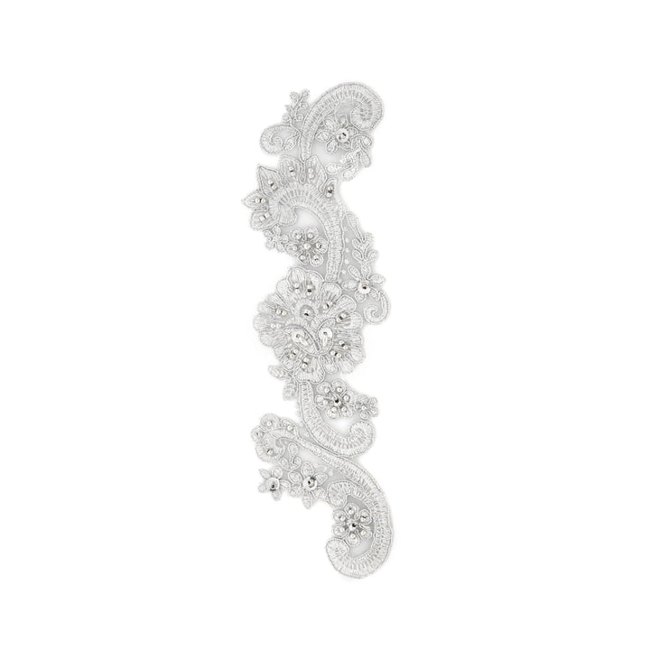 Decorative silver lace strip on a white background