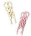 Two hair clips, one beige and one pink, on a white background