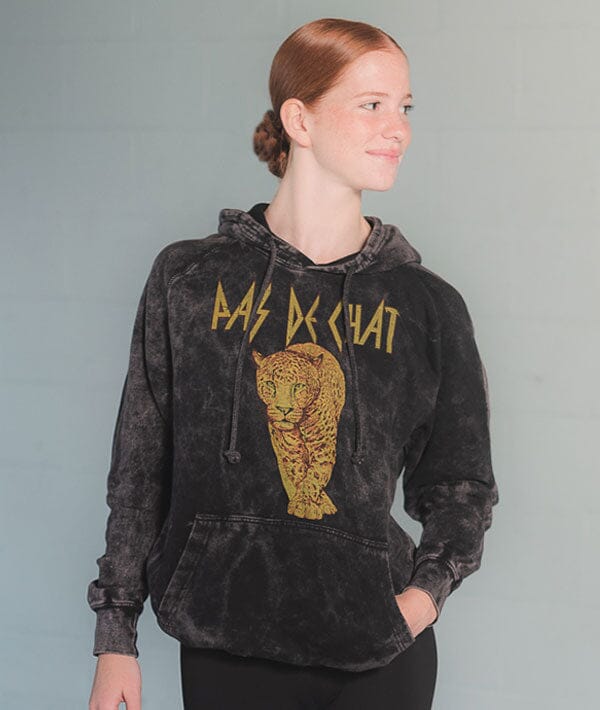 Female red headed dancer in a hoodie