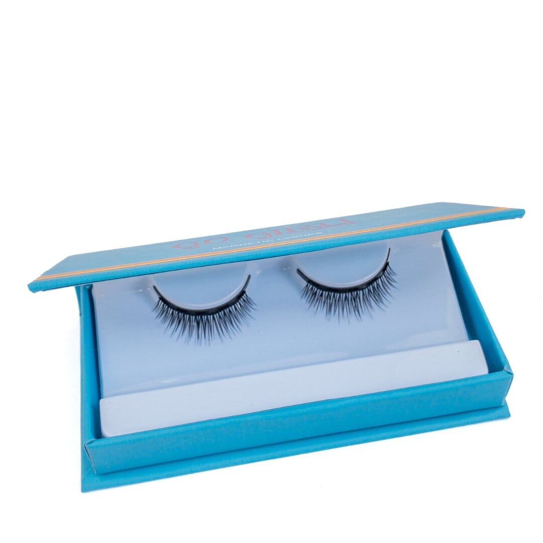 Pair of false eyelashes in a blue case on a white background
